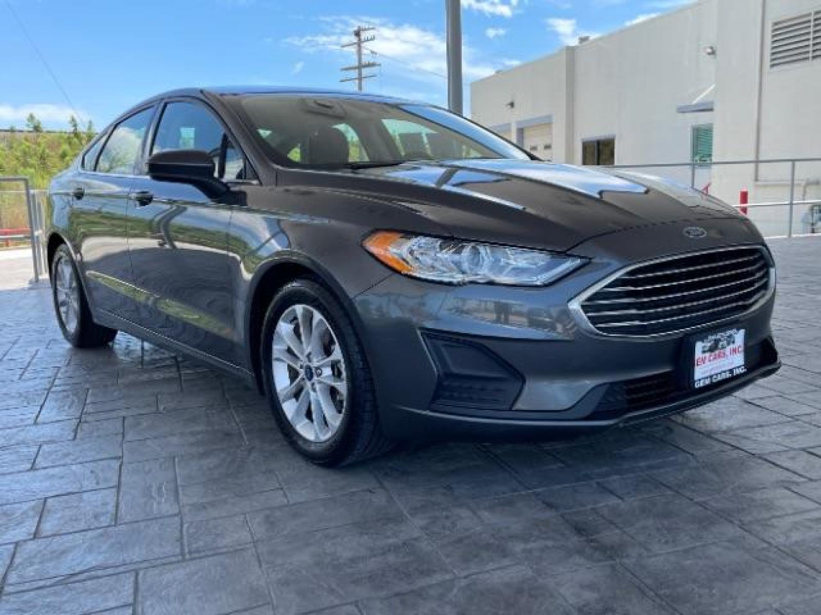 2019 Magnetic Metallic /Ebony, cloth Ford Fusion SE (3FA6P0HD5KR) with an 1.5L L4 DOHC 16V engine, 6-Speed Automatic transmission, located at 12182 Garland Rd, Dallas, TX, 75218, (214) 521-2040, 0.000000, 0.000000 - Photo #0