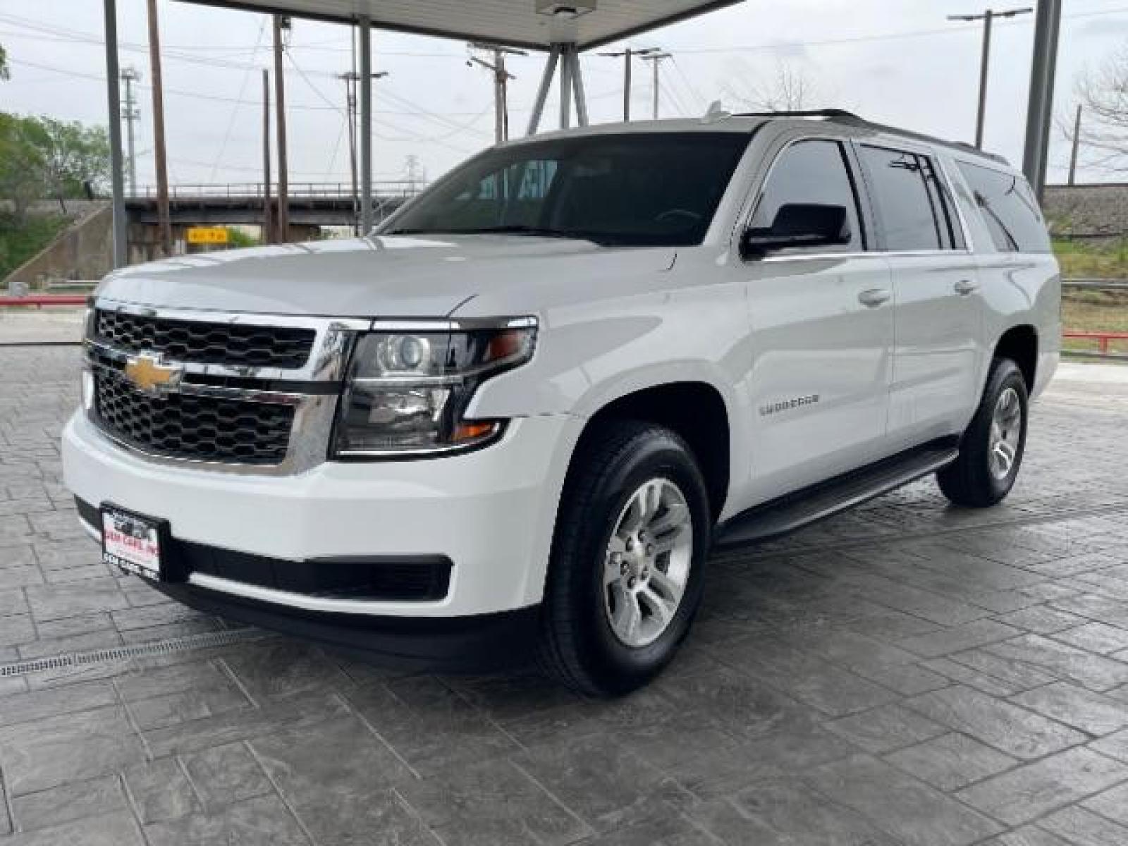 2018 Summit White Chevrolet Suburban LS 2WD (1GNSCGKC6JR) with an 5.3L V8 OHV 16V engine, 6-Speed Automatic transmission, located at 12182 Garland Rd, Dallas, TX, 75218, (214) 521-2040, 0.000000, 0.000000 - Photo #2