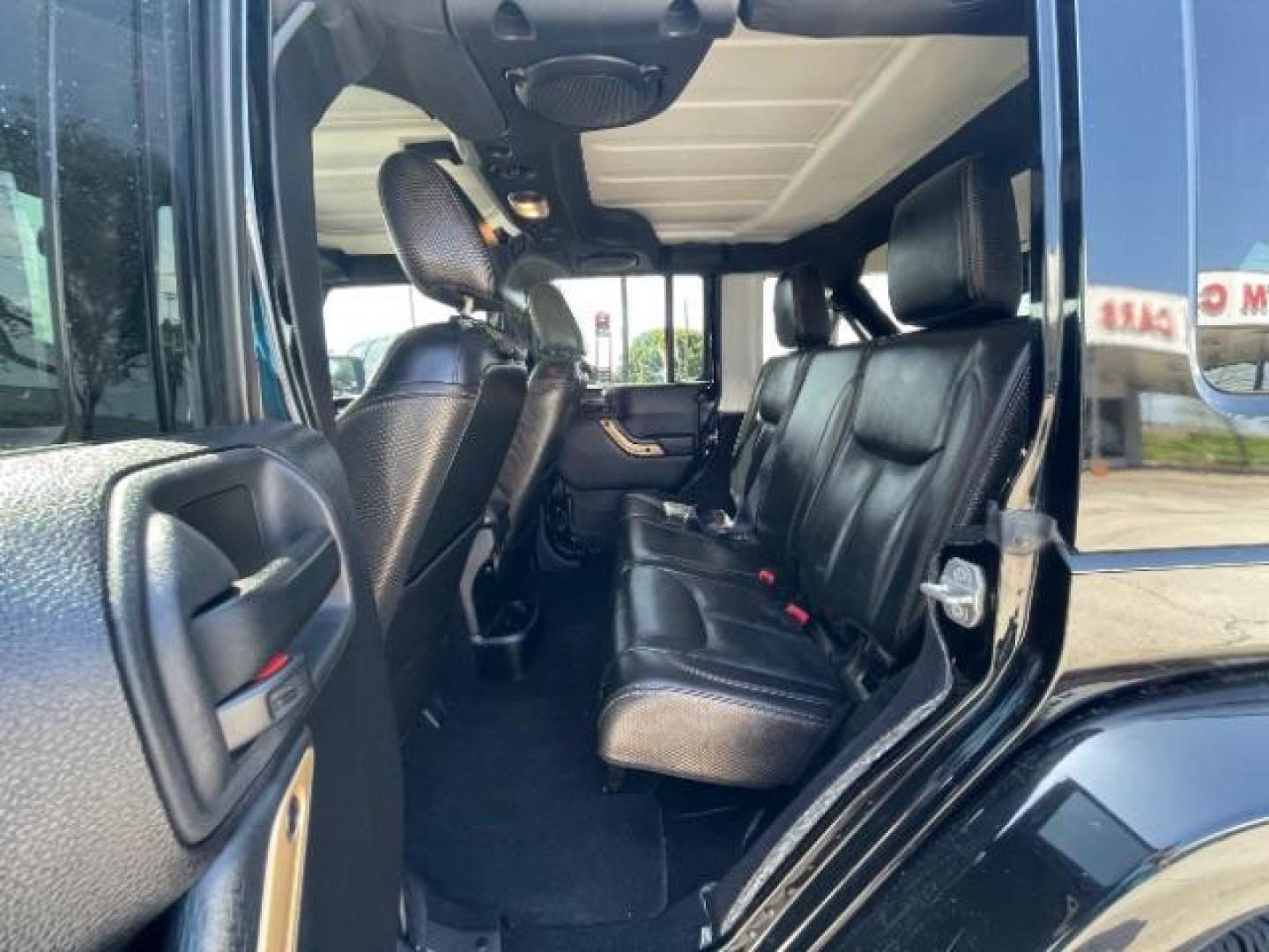 2014 Black Clearcoat Jeep Wrangler Unlimited Sahara 4WD (1C4BJWEG9EL) with an 3.6L V6 DOHC 24V FFV engine, located at 12182 Garland Rd, Dallas, TX, 75218, (214) 521-2040, 0.000000, 0.000000 - Photo#10