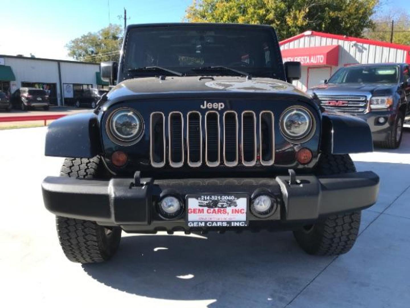 2014 Black Clearcoat /Black Jeep Wrangler Unlimited Sahara 4WD (1C4BJWEG9EL) with an 3.6L V6 DOHC 24V FFV engine, 5-Speed Automatic transmission, located at 12182 Garland Rd, Dallas, TX, 75218, (214) 521-2040, 0.000000, 0.000000 - Photo#1