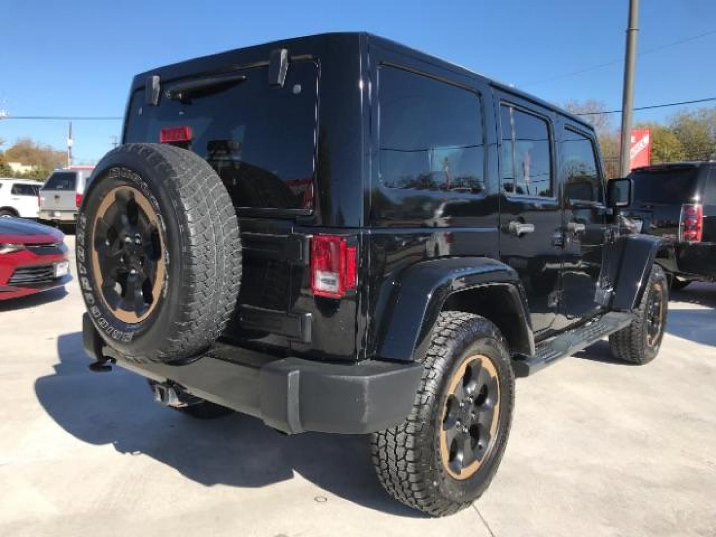 2014 Black Clearcoat /Black Jeep Wrangler Unlimited Sahara 4WD (1C4BJWEG9EL) with an 3.6L V6 DOHC 24V FFV engine, 5-Speed Automatic transmission, located at 12182 Garland Rd, Dallas, TX, 75218, (214) 521-2040, 0.000000, 0.000000 - Photo#2