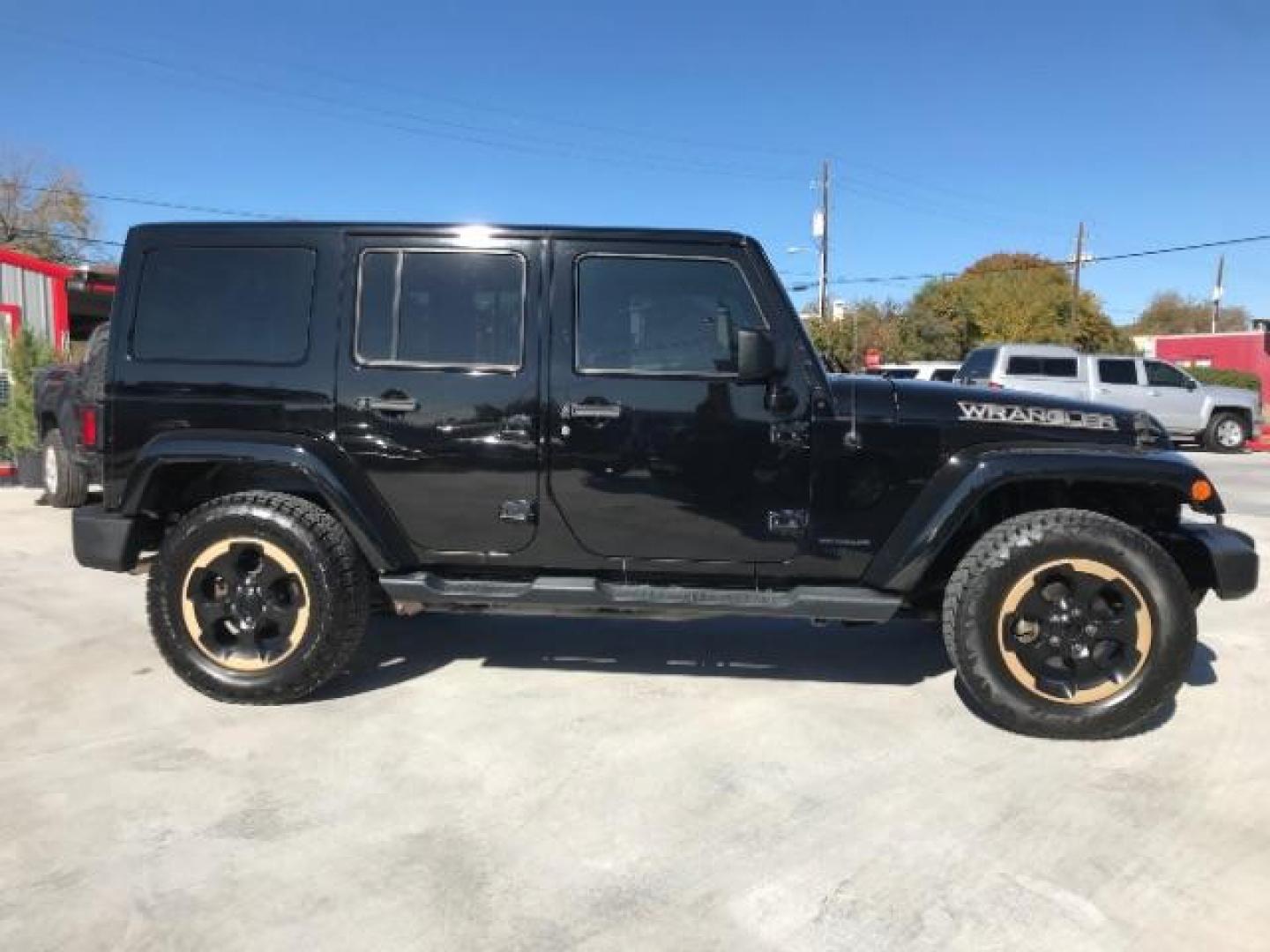 2014 Black Clearcoat /Black Jeep Wrangler Unlimited Sahara 4WD (1C4BJWEG9EL) with an 3.6L V6 DOHC 24V FFV engine, 5-Speed Automatic transmission, located at 12182 Garland Rd, Dallas, TX, 75218, (214) 521-2040, 0.000000, 0.000000 - Photo#3