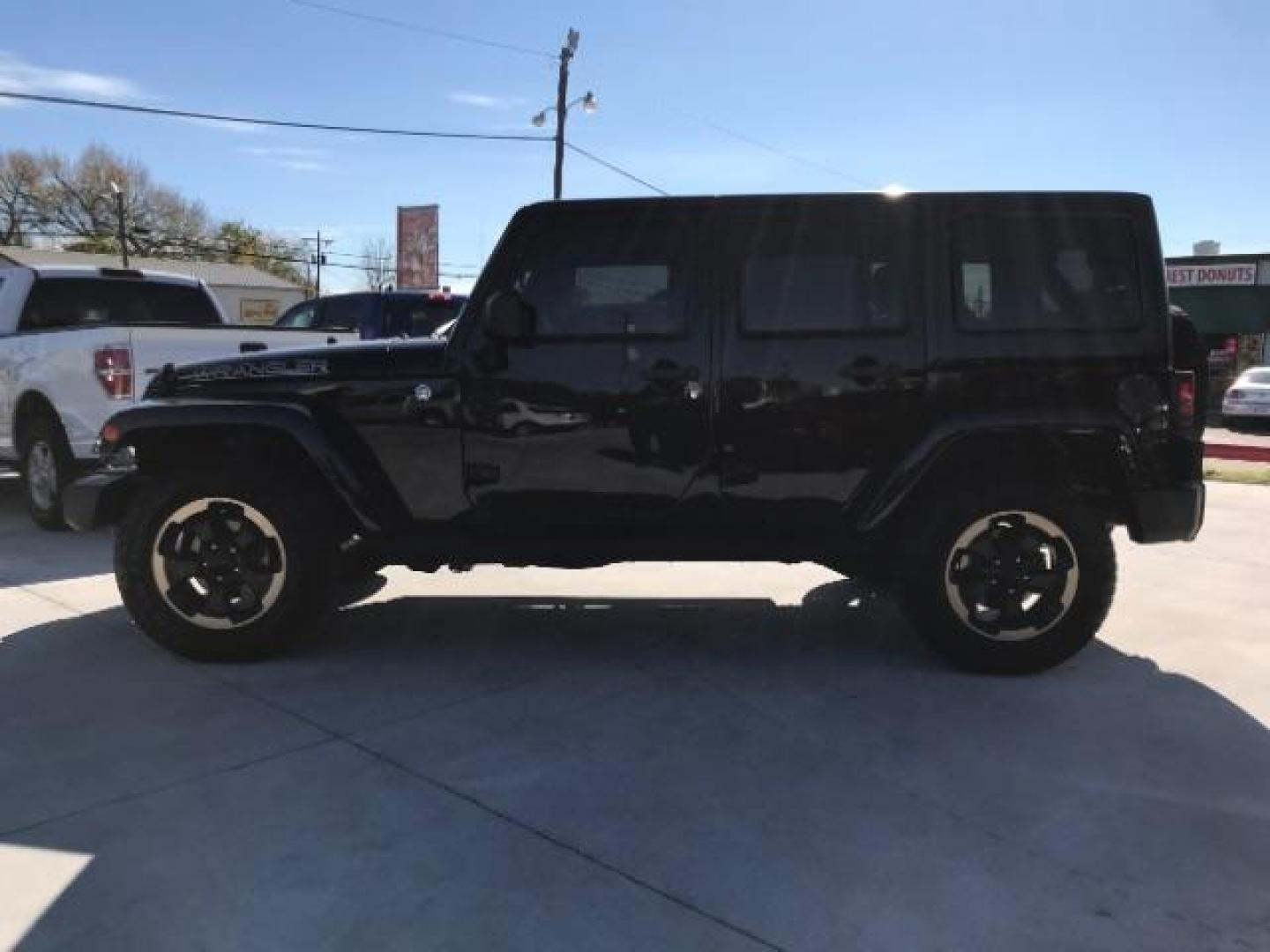 2014 Black Clearcoat /Black Jeep Wrangler Unlimited Sahara 4WD (1C4BJWEG9EL) with an 3.6L V6 DOHC 24V FFV engine, 5-Speed Automatic transmission, located at 12182 Garland Rd, Dallas, TX, 75218, (214) 521-2040, 0.000000, 0.000000 - Photo#5