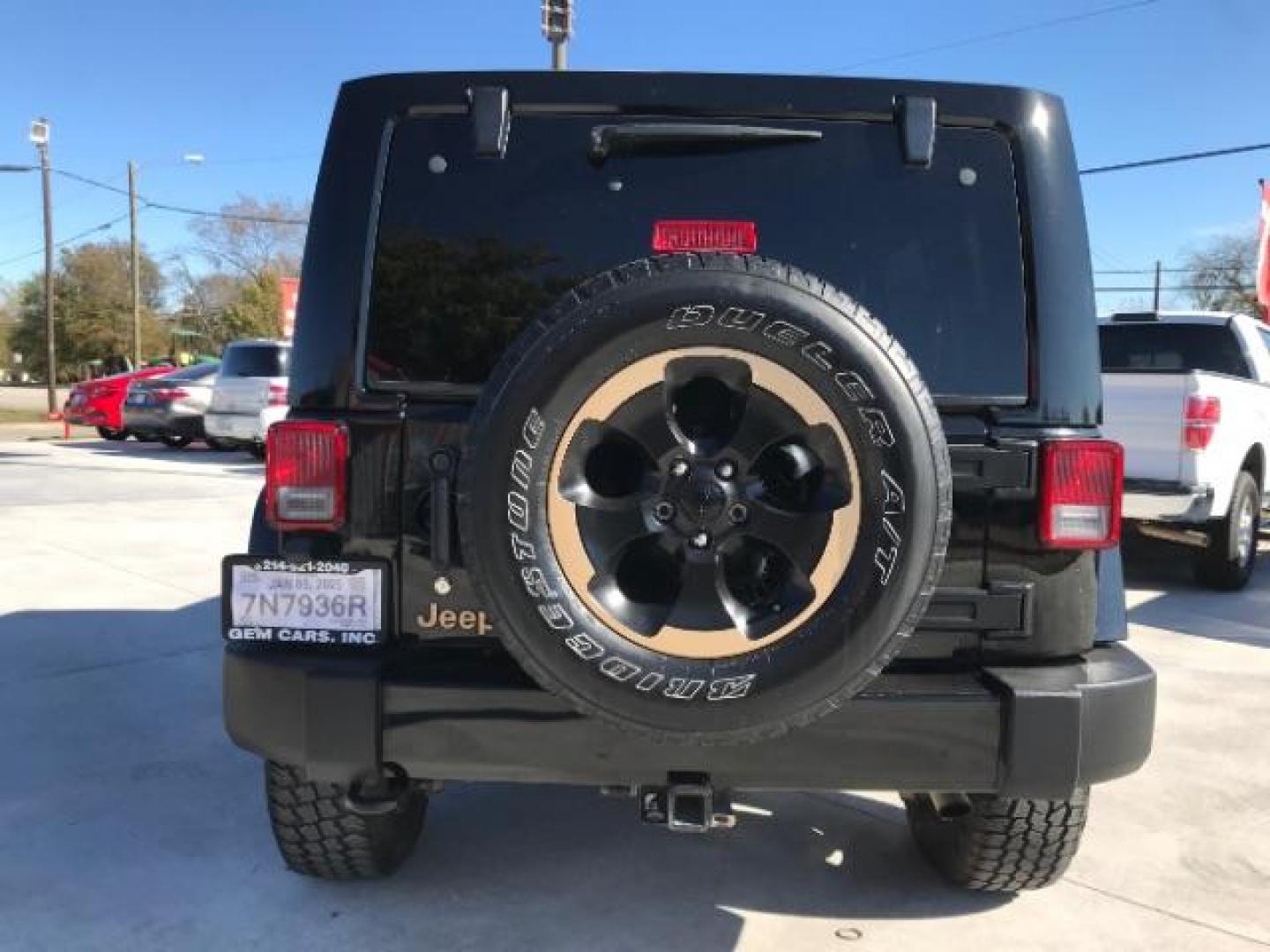 2014 Black Clearcoat /Black Jeep Wrangler Unlimited Sahara 4WD (1C4BJWEG9EL) with an 3.6L V6 DOHC 24V FFV engine, 5-Speed Automatic transmission, located at 12182 Garland Rd, Dallas, TX, 75218, (214) 521-2040, 0.000000, 0.000000 - Photo#7