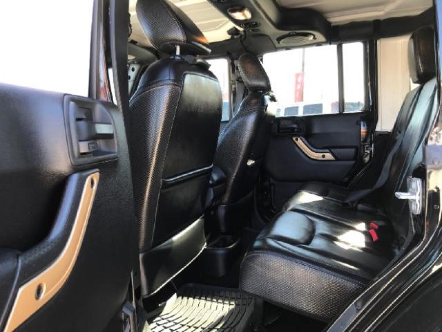 2014 Black Clearcoat /Black Jeep Wrangler Unlimited Sahara 4WD (1C4BJWEG9EL) with an 3.6L V6 DOHC 24V FFV engine, 5-Speed Automatic transmission, located at 12182 Garland Rd, Dallas, TX, 75218, (214) 521-2040, 0.000000, 0.000000 - Photo#8