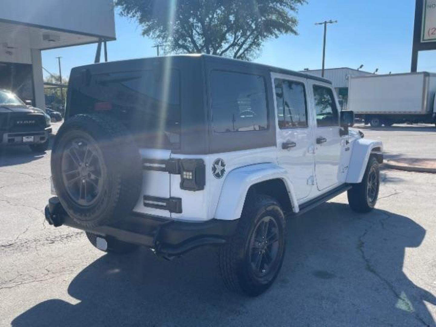 2018 Bright White Clear Coat /Black Leather Trim with Embossed inserts Jeep Wrangler JK Unlimited Sport 4WD (1C4BJWDG0JL) with an 3.6L V6 DOHC 24V FFV engine, 6-Speed Automatic transmission, located at 12182 Garland Rd, Dallas, TX, 75218, (214) 521-2040, 0.000000, 0.000000 - Photo#6