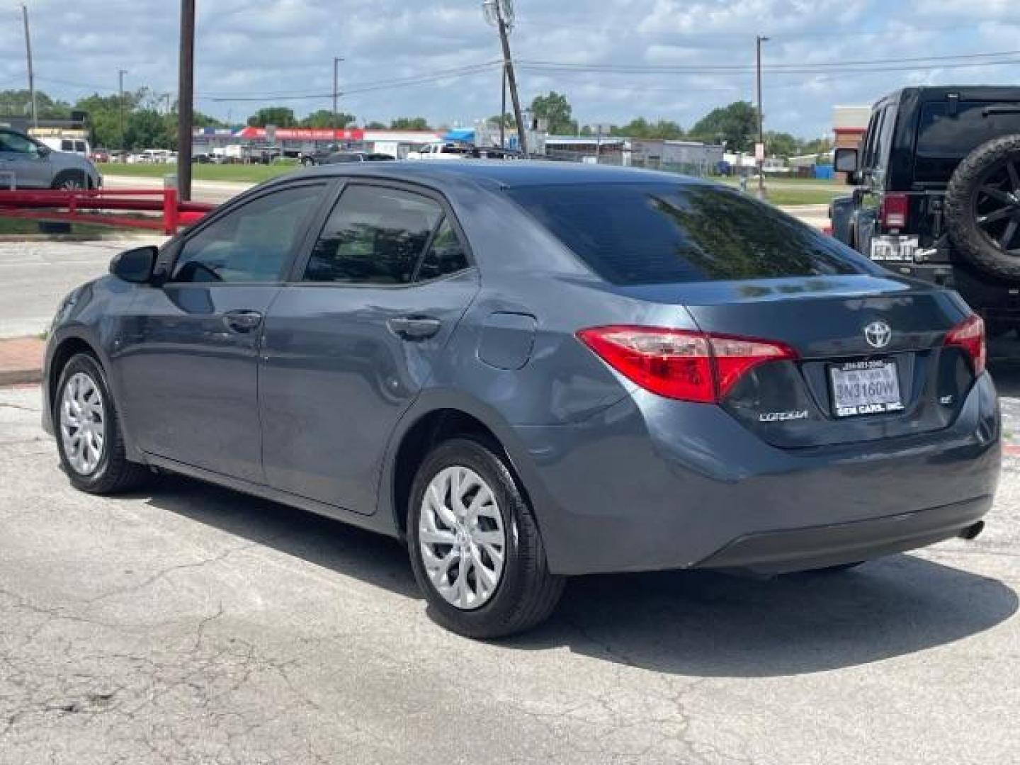 2018 Falcon Gray Metallic Toyota Corolla LE CVT (5YFBURHE7JP) with an 1.8L L4 DOHC 16V engine, Continuously Variable Transmission transmission, located at 12182 Garland Rd, Dallas, TX, 75218, (214) 521-2040, 0.000000, 0.000000 - Photo#2