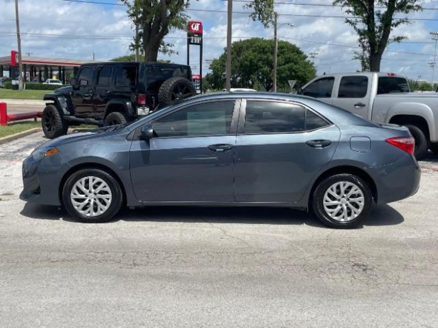 2018 Falcon Gray Metallic Toyota Corolla LE CVT (5YFBURHE7JP) with an 1.8L L4 DOHC 16V engine, Continuously Variable Transmission transmission, located at 12182 Garland Rd, Dallas, TX, 75218, (214) 521-2040, 0.000000, 0.000000 - Photo#3