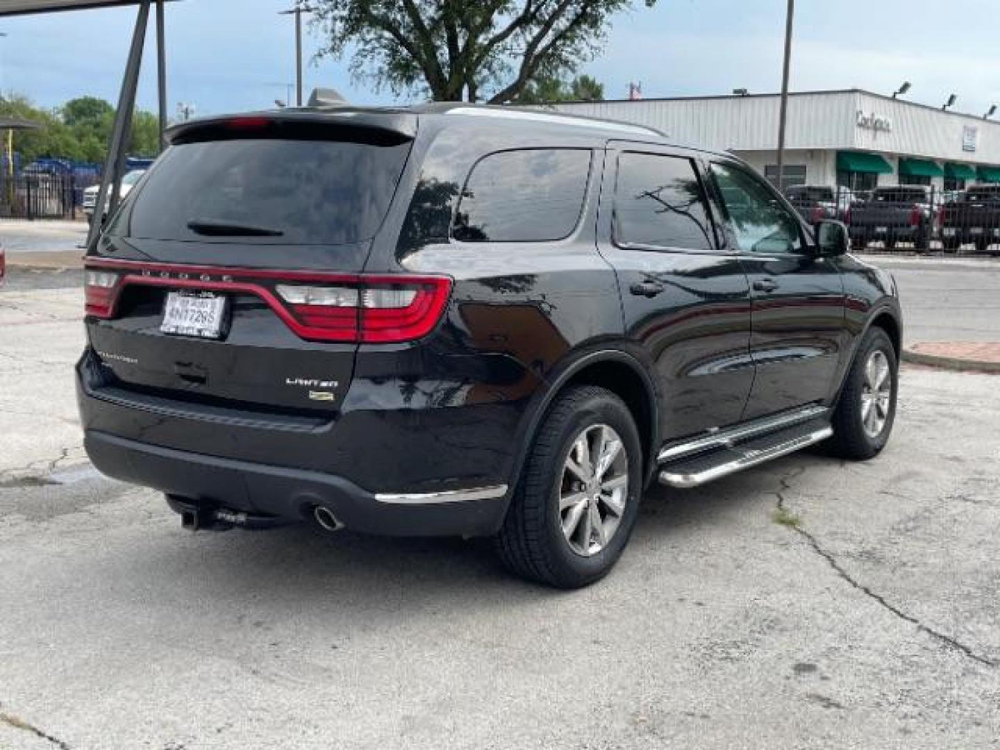 2015 Brilliant Black Crystal Pearl Coat Dodge Durango Limited AWD (1C4RDJDG1FC) with an 3.6L V6 DOHC 24V engine, 8-Speed Automatic transmission, located at 12182 Garland Rd, Dallas, TX, 75218, (214) 521-2040, 0.000000, 0.000000 - Photo#4