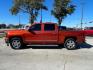 2015 Orange Chevrolet Silverado 1500 LTZ Crew Cab 2WD (3GCPCSEC9FG) with an 5.3L V8 OHV 16V engine, 6-Speed Automatic transmission, located at 12182 Garland Rd, Dallas, TX, 75218, (214) 521-2040, 0.000000, 0.000000 - Photo#1