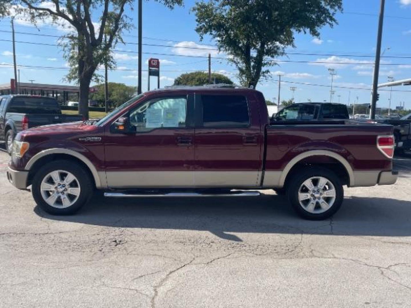 2009 Royal Red Metallic Ford F-150 Lariat SuperCrew 5.5-ft. Bed 2WD (1FTPW12V09F) with an 5.4L V8 SOHC 24V FFV engine, located at 12182 Garland Rd, Dallas, TX, 75218, (214) 521-2040, 0.000000, 0.000000 - Photo#1