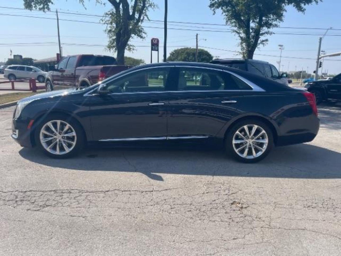 2014 Sapphire Blue Metall /Jet Black Cadillac XTS Luxury FWD (2G61M5S37E9) with an 3.6L V6 DOHC 24V engine, 6-Speed Automatic transmission, located at 12182 Garland Rd, Dallas, TX, 75218, (214) 521-2040, 0.000000, 0.000000 - Photo#3